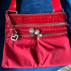 Brighton bag RED adjustable strap backside slit patent leather trim.